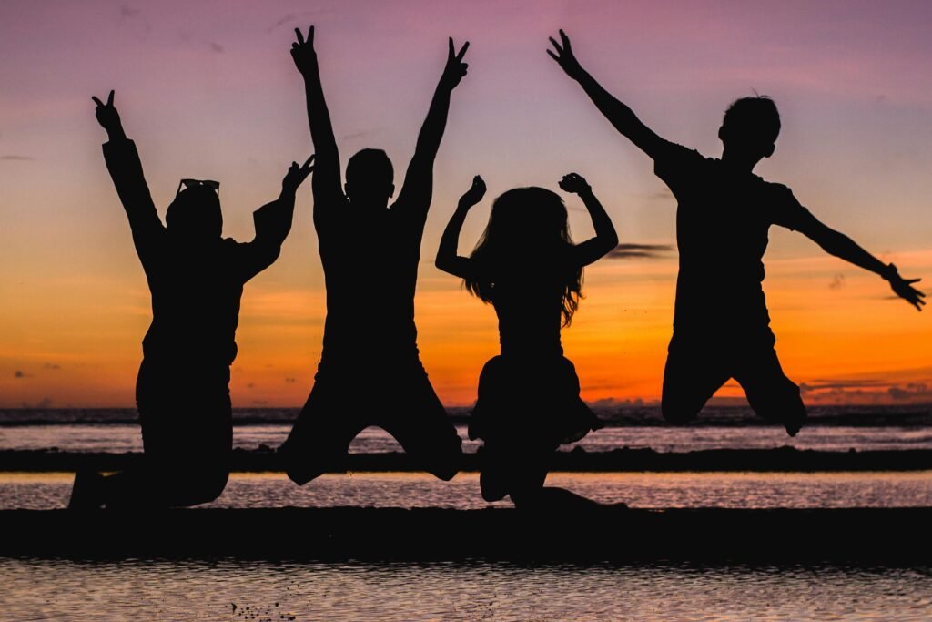 Silhouette of People Jumping